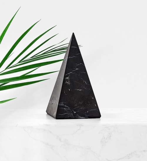 Natural mineral veins and inclusions visible in an authentic Shungite pyramid from Modern ŌM