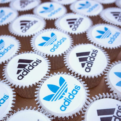 Corporate cupcakes with logo toppers Corporate cupcakes with logo toppers