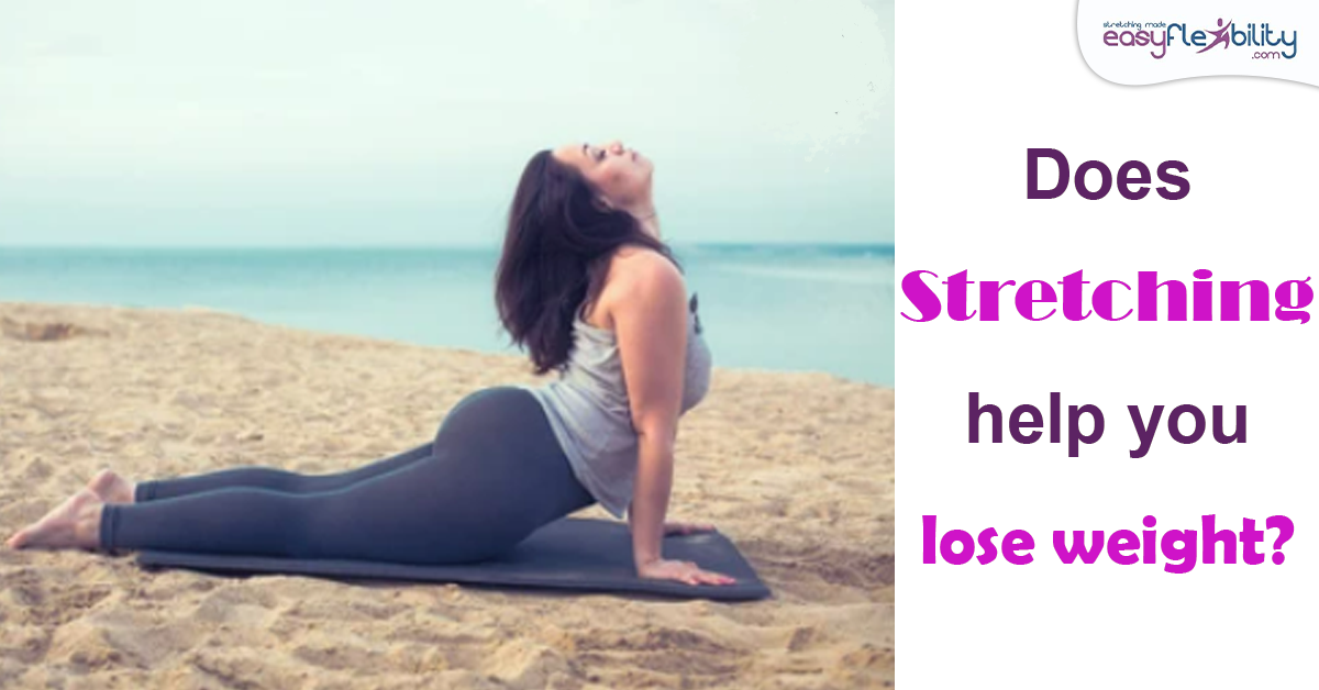 A woman doing cobra on the beach trying to lose weight by stretching. 