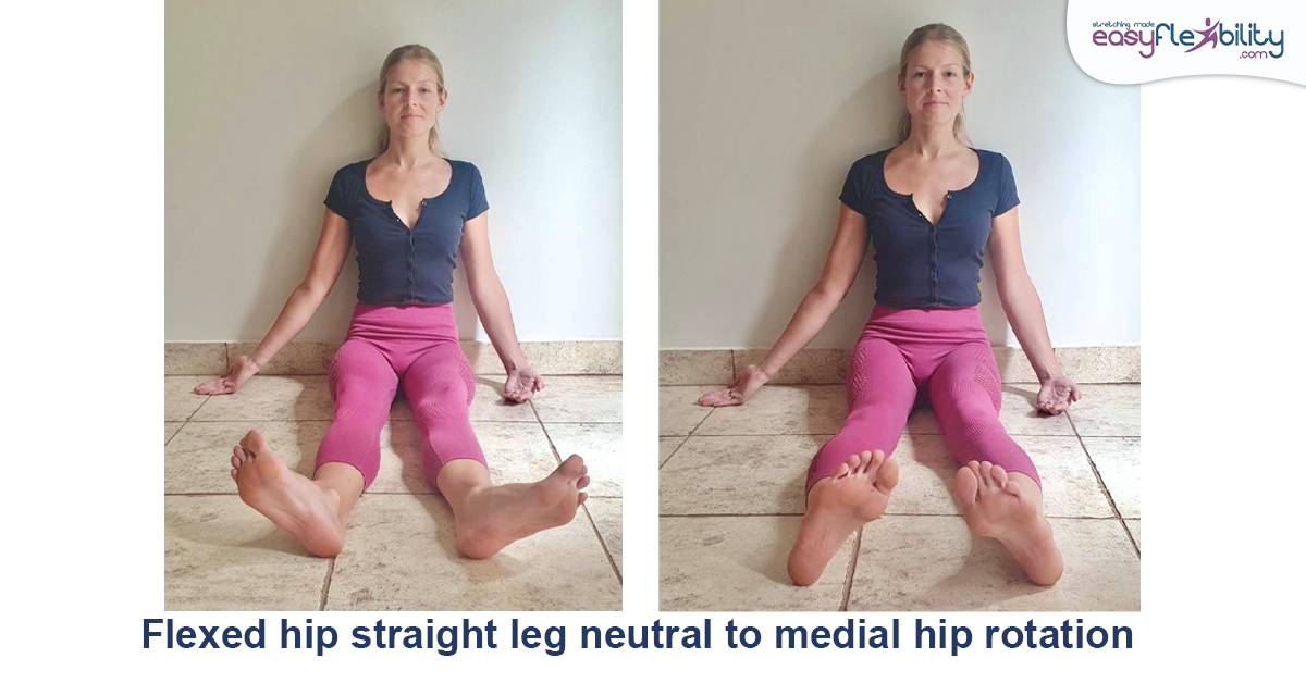 A woman sitting on the floor doing medial hip rotation 