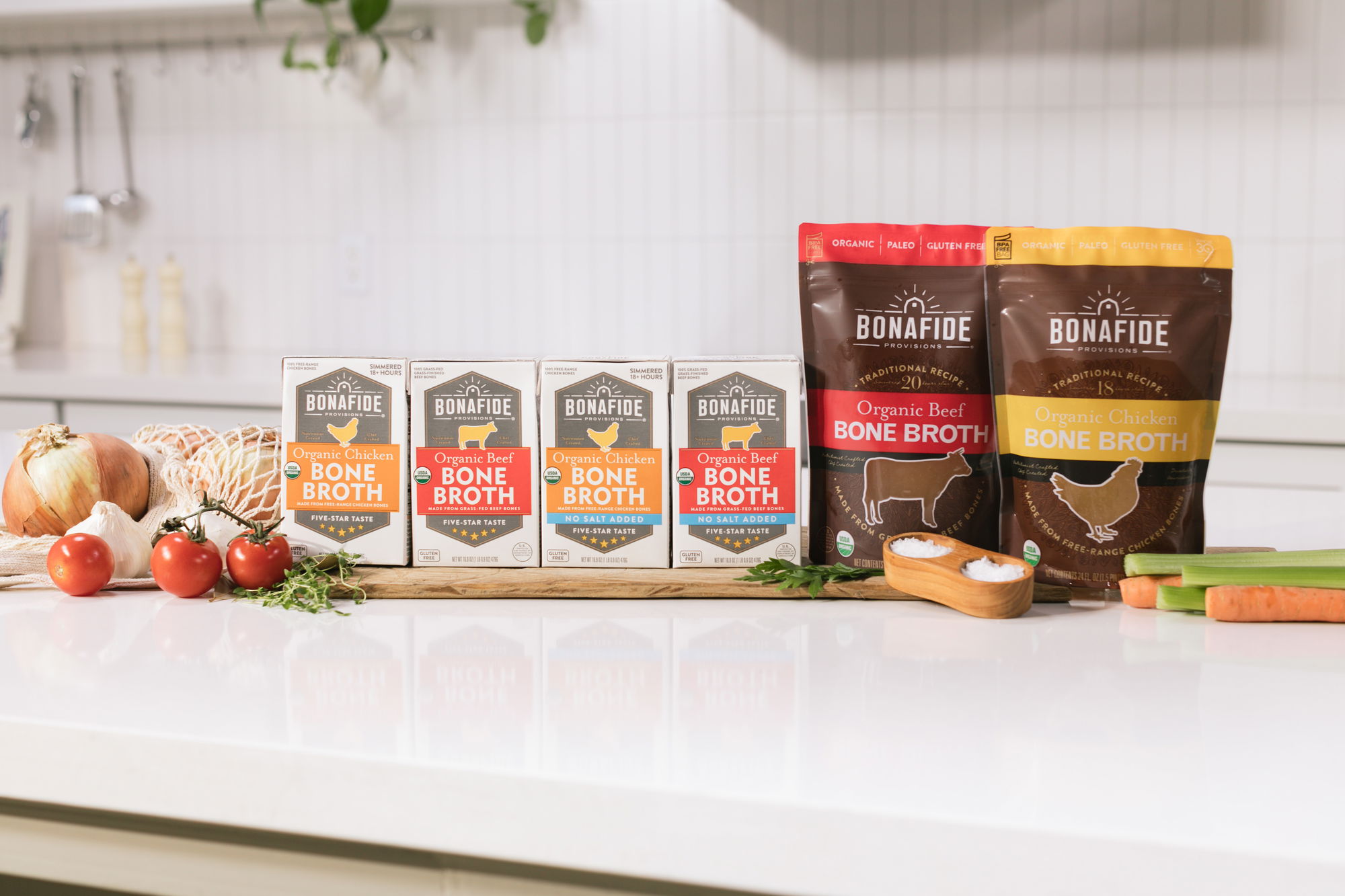 row of three cups of bone broth with organic ingredients