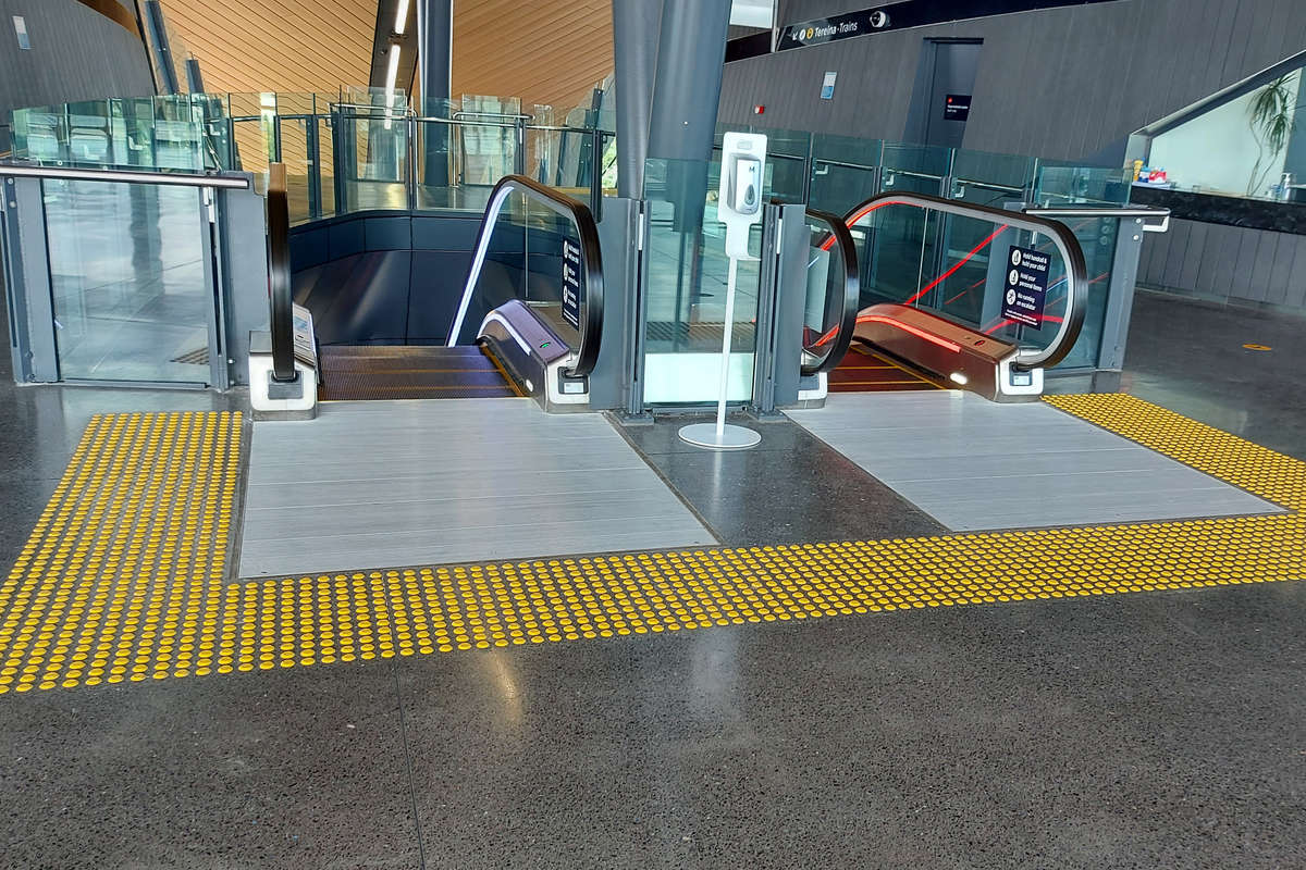 TacPro yellow polyurethane tactile indicators at top of escalators