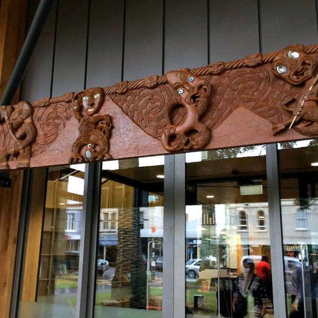 Traditional Maori carved archway over main entrance to library