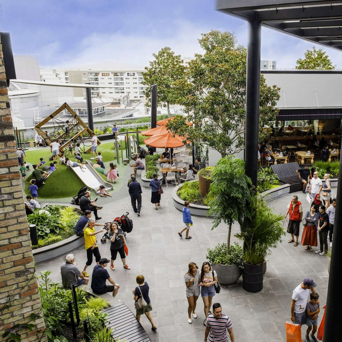 High angle photo of people in rooftop dining area