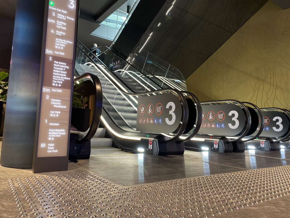 TacPro stainless steel tactile indicators at the bottom of escalators
