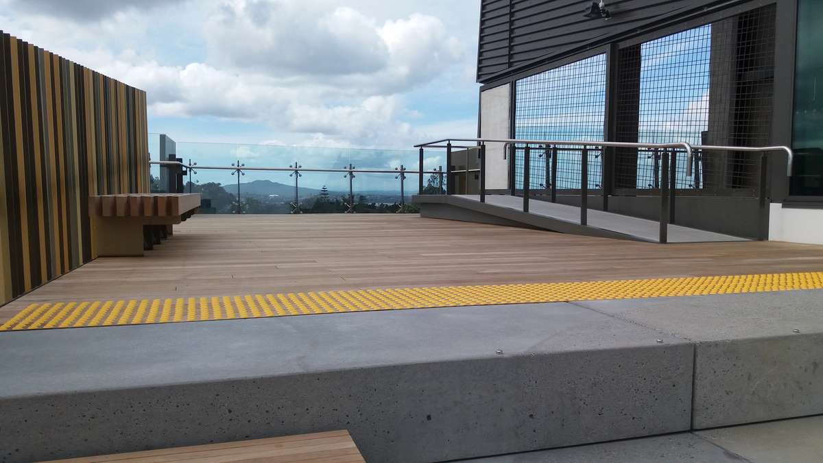 TacPro yellow polyurethane tactile indicators installed to timber at top of lookout stairs