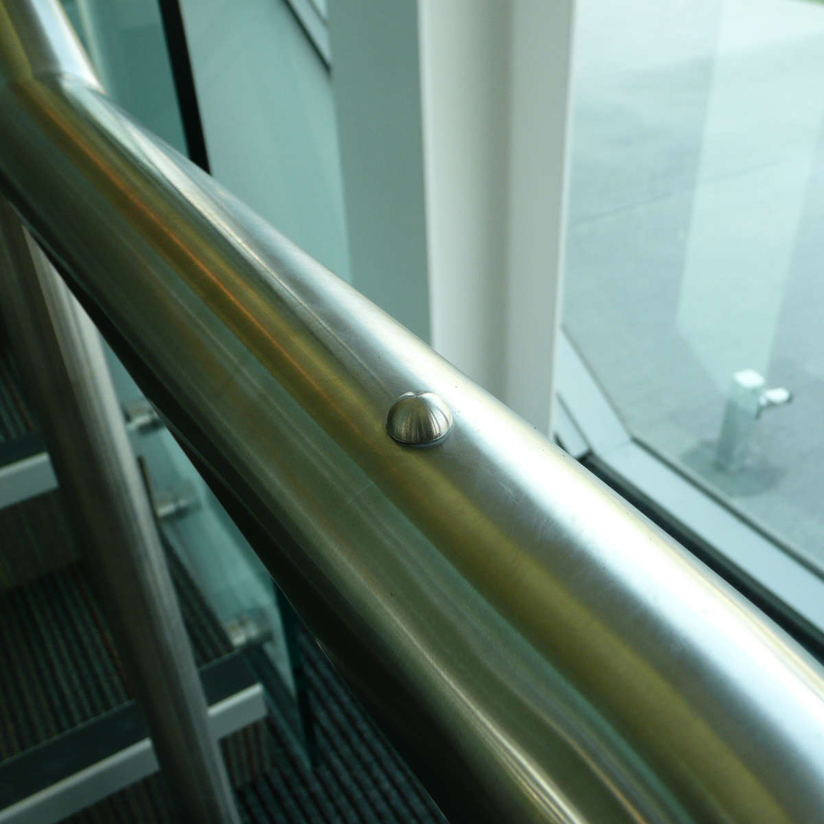 TacPro stainless steel handrail dome installed to stainless steel handrail