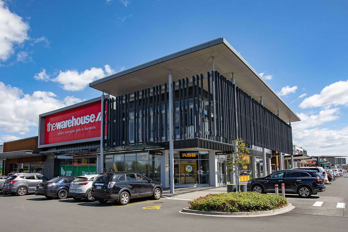 Context photo of shopping centre corner (the Warehouse and ASB Bank) as viewed from the carpark.