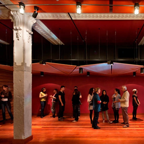 People socialising inside theatre