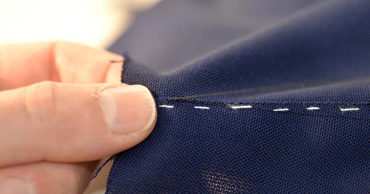 Sartoria Sciarra hand sewn seams with Italian Silk thread on a luxury bespoke suit made from Navy Loro Piana high twist wool pure luxury bespoke tailoring, soft Italian tailoring.