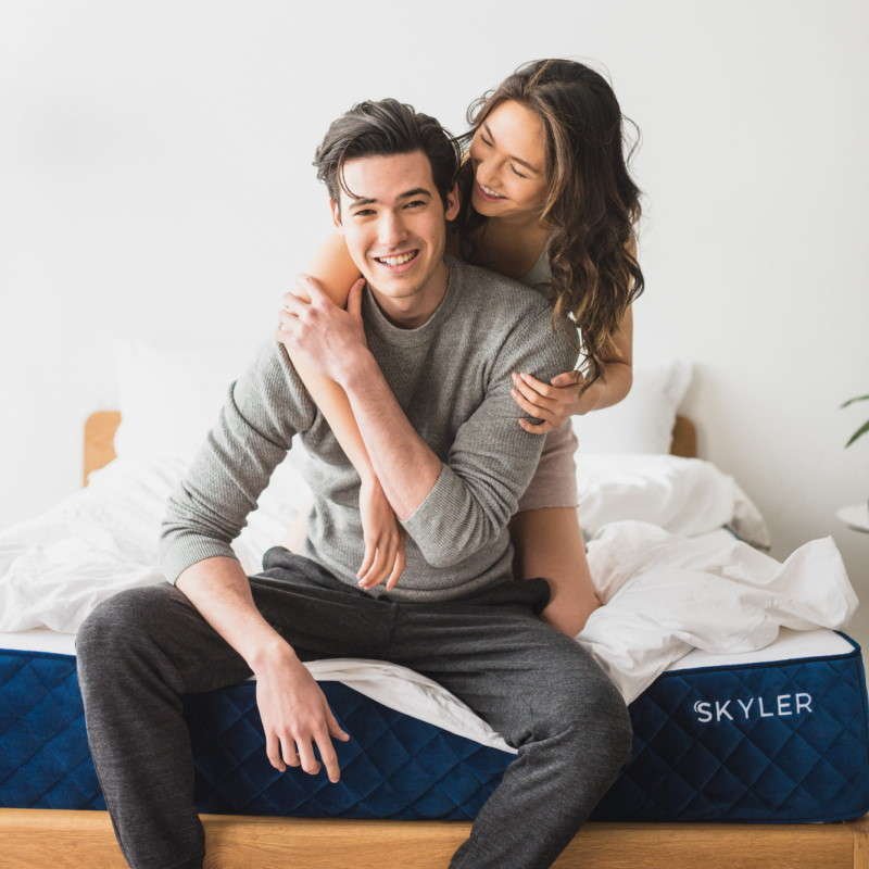 Couple hugging on the Skyler mattress