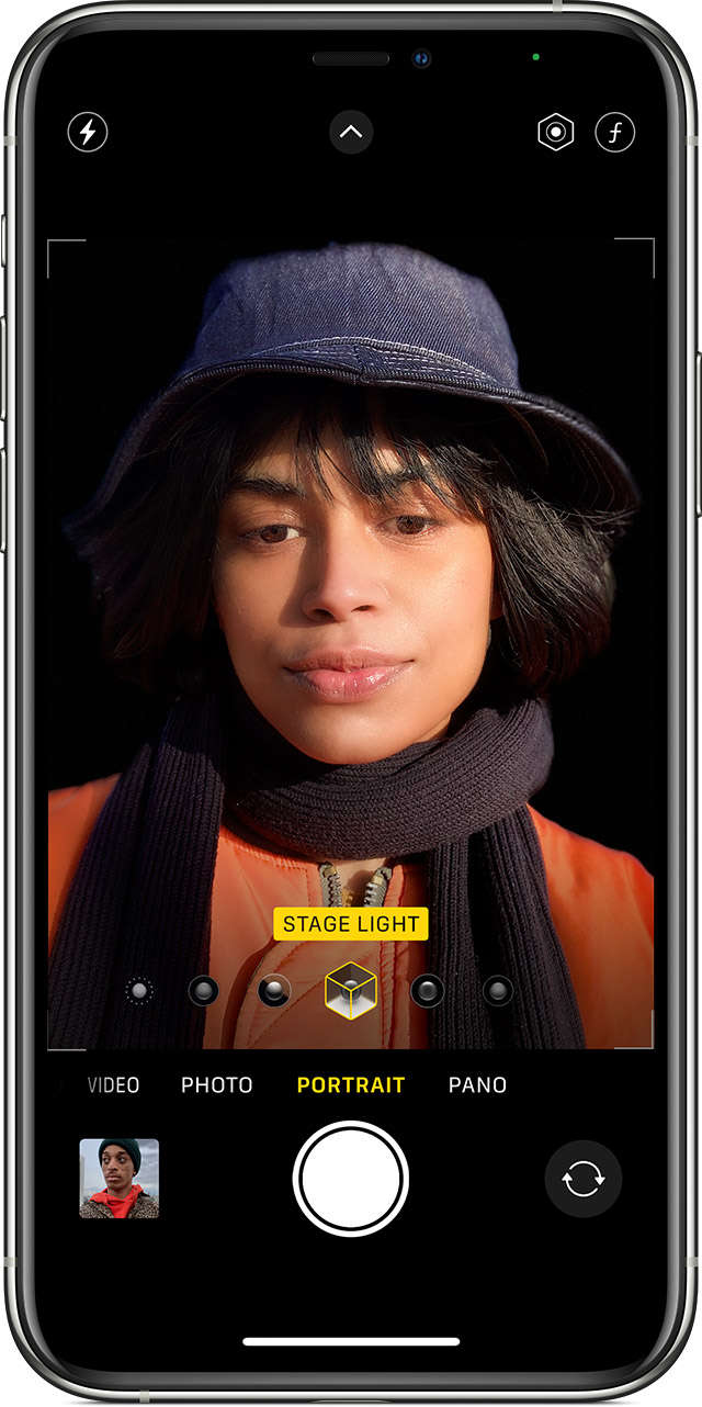 iPhone 13 on Portrait mode using the Stage Light effect to take a selfie