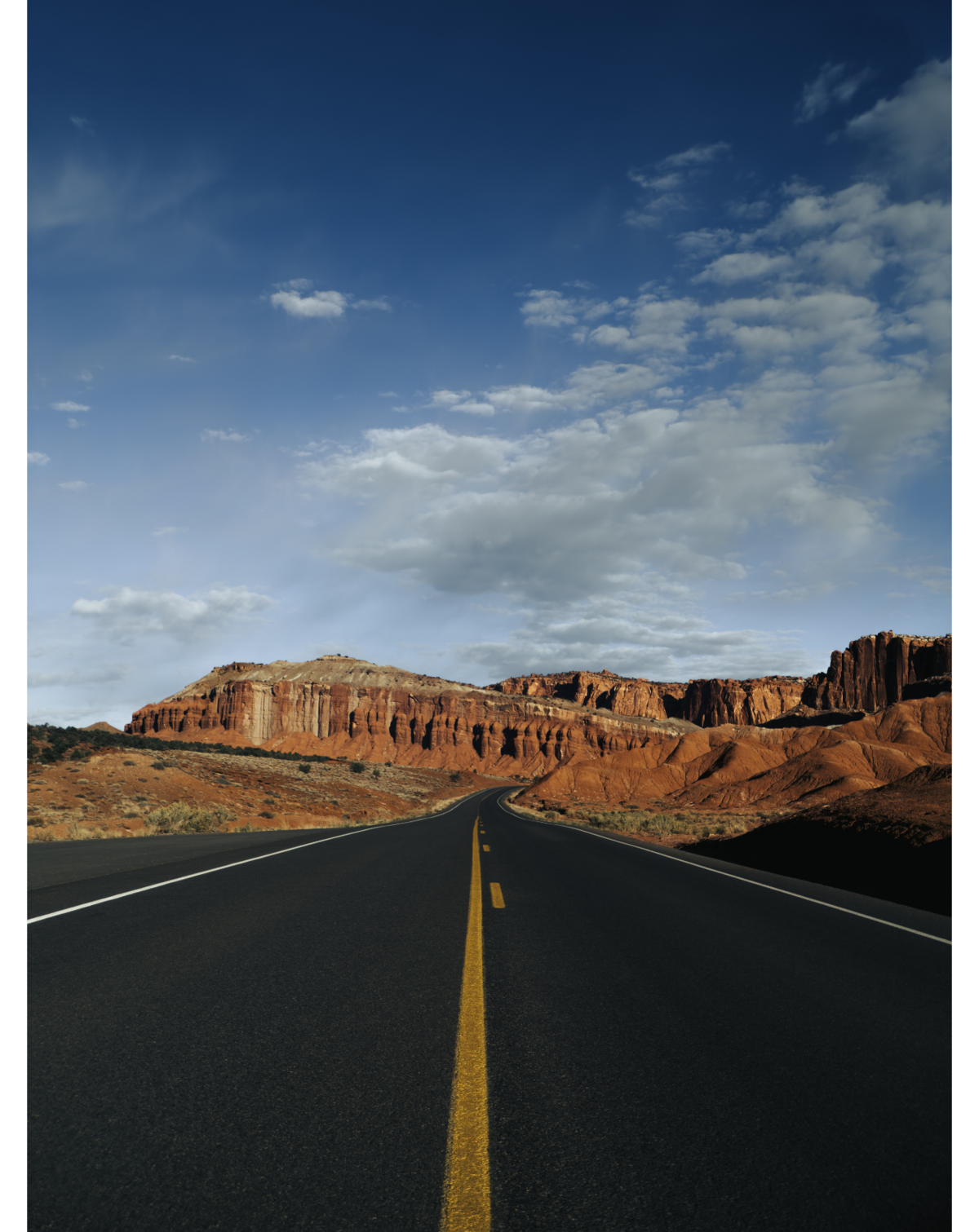 Image of road leading towards mountain shot on iPhone and SANDMARC wid lens.