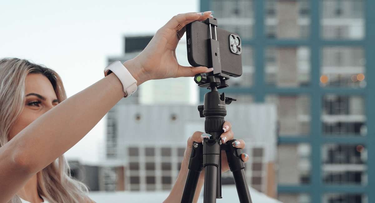 our mini tripod with flexible legs. Carry around easily and mount your phone to it