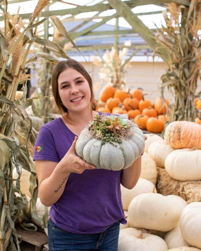 Shawnee holding succulent pumpkin.