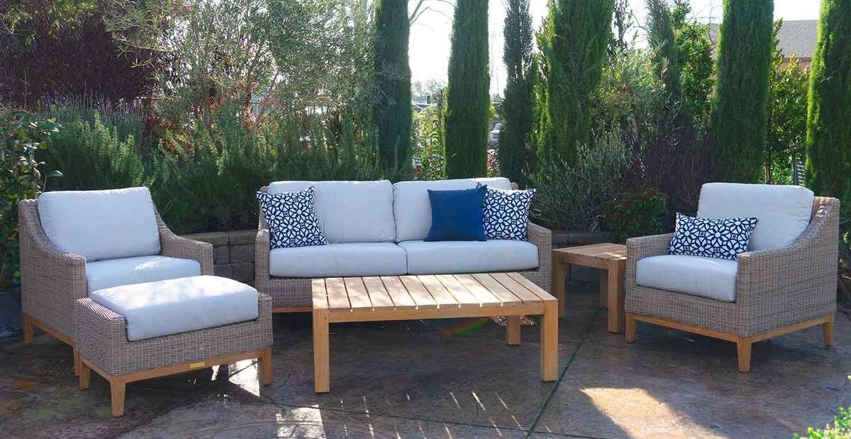 Outdoor furniture set featuring chairs, loveseat, ottoman, and coffee table
