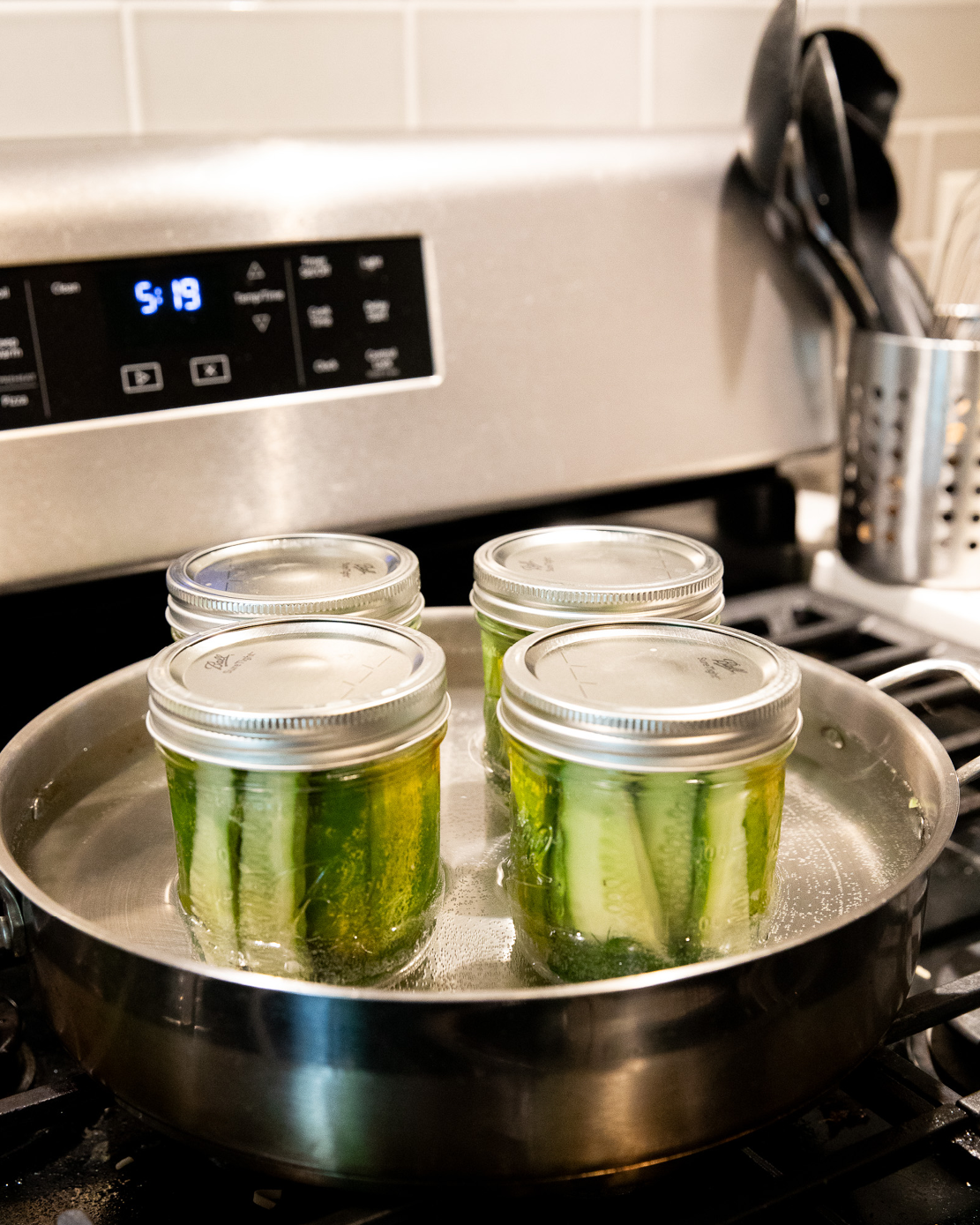 Pickles undergoing water bath canning