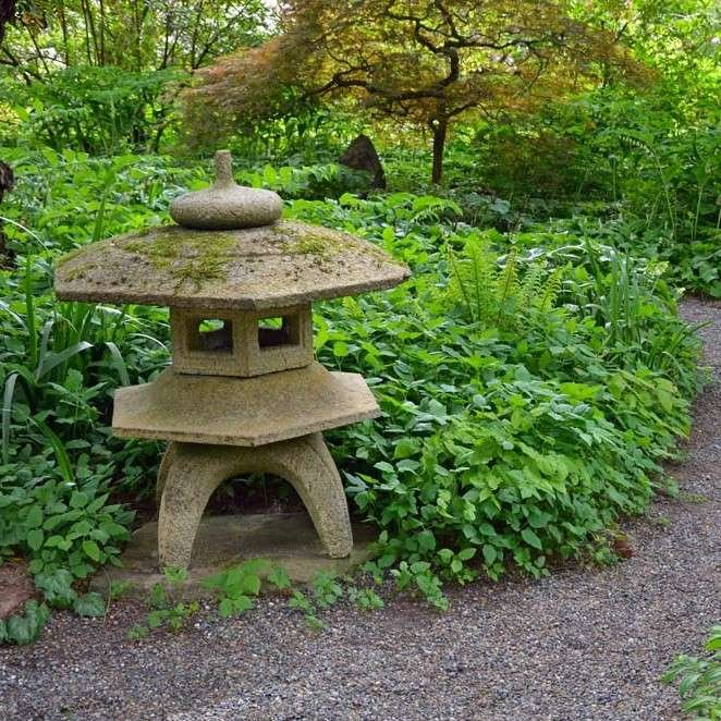 Stone pagoda sculpture in a garden
