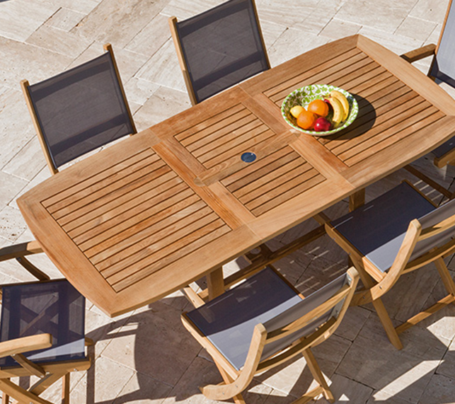 Teak dinning table and six surrounding chairs 