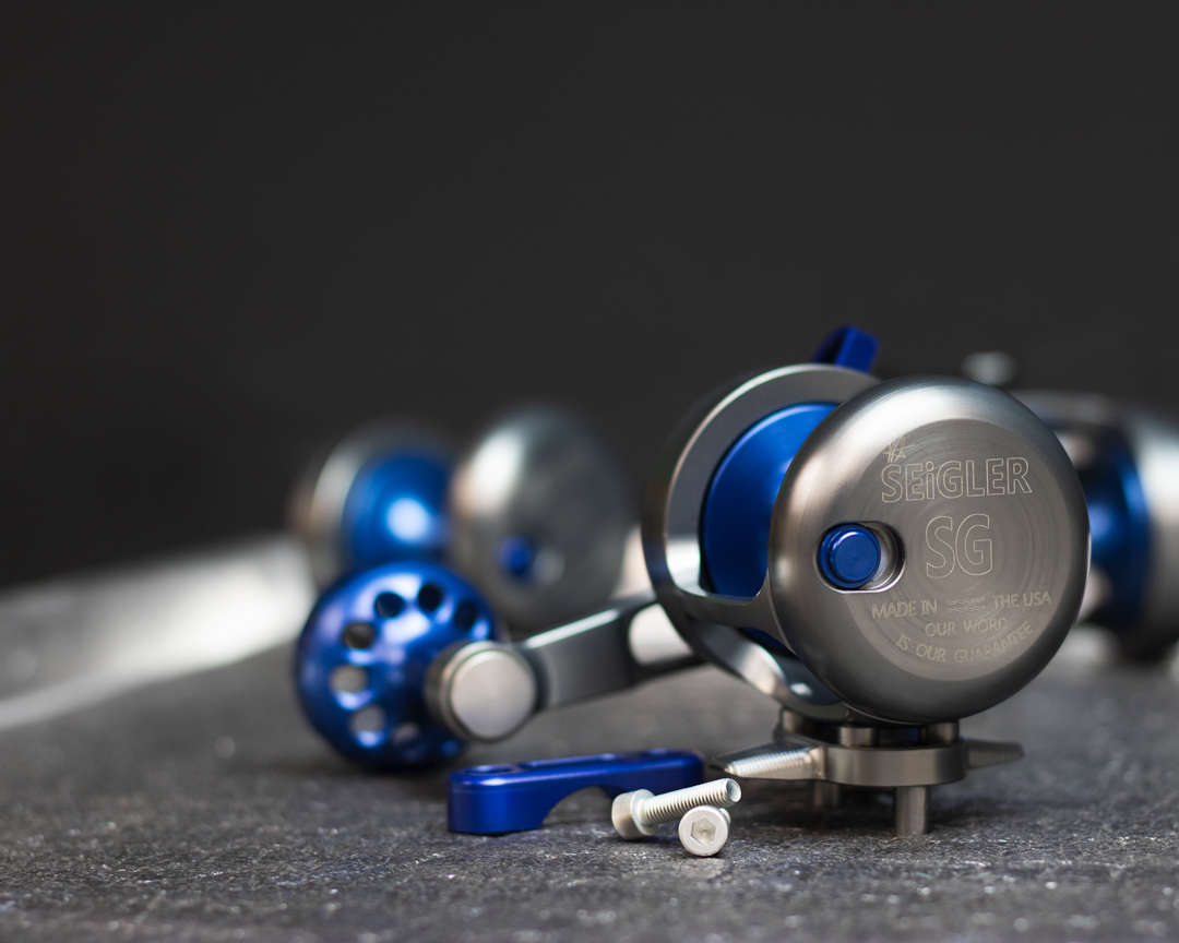 Blue fishing reel on tray. Blue fishing reel on tray.
