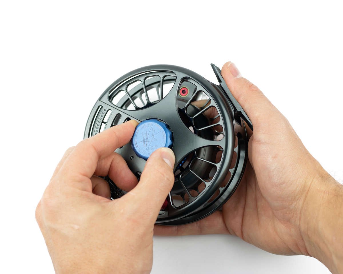 adjusting the preset dial on the seigler saltwater fly reel. 