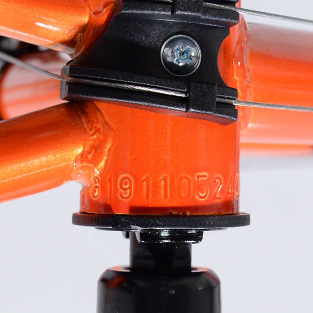Orange bike with close-up of frame's bottom bracket to show serial number