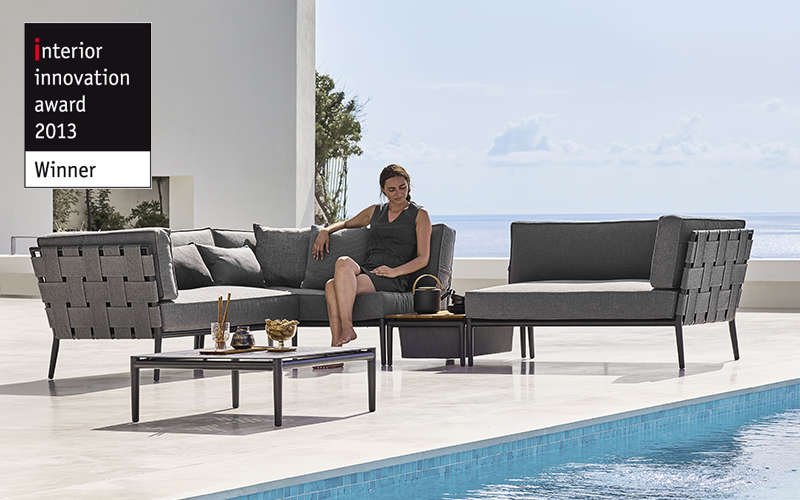Conic grey outdoor lounge sofas  by the pool