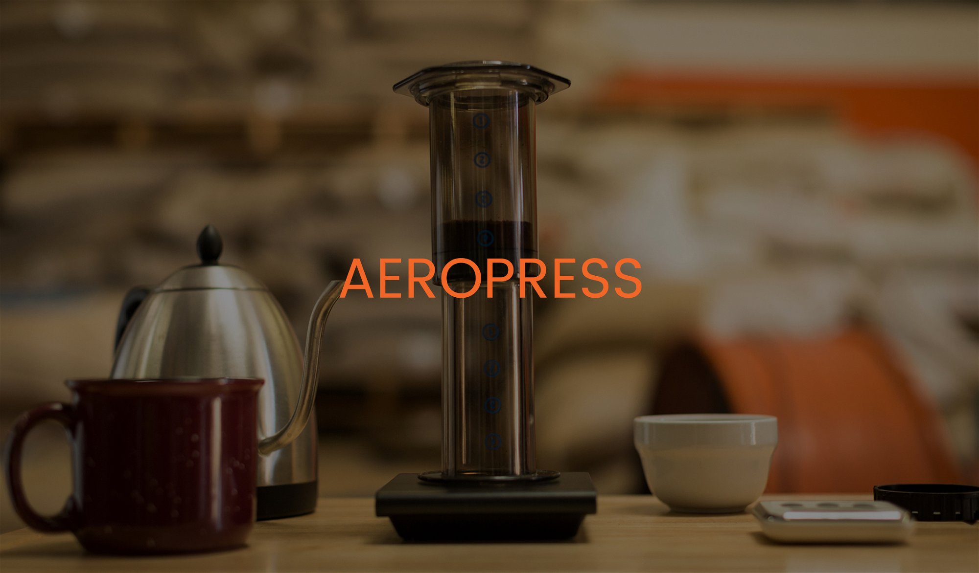 Aeropress on scale with mug and kettle. Titled "Aeropress"