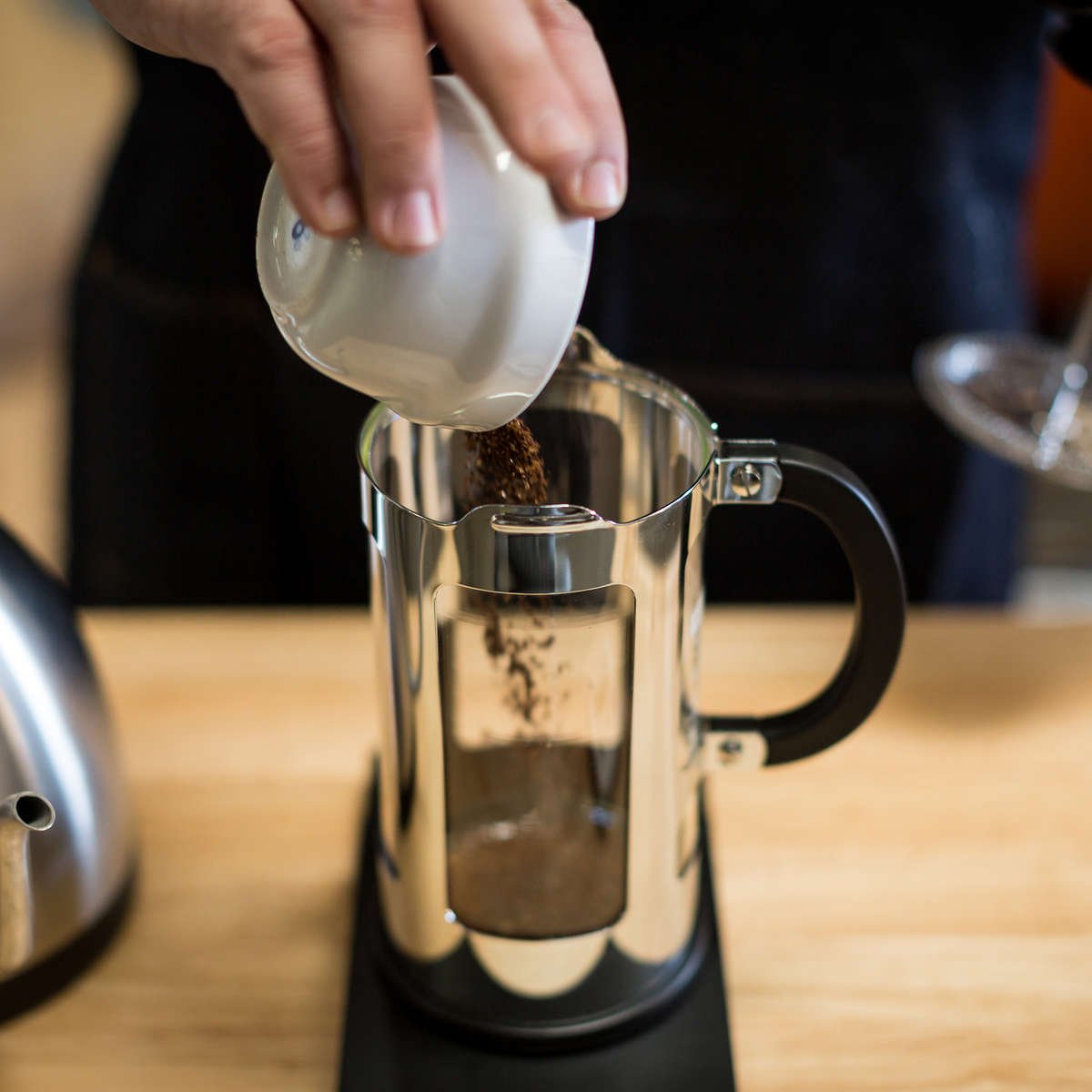 COFFEE BEING POURED INTO FRENCH PRESS