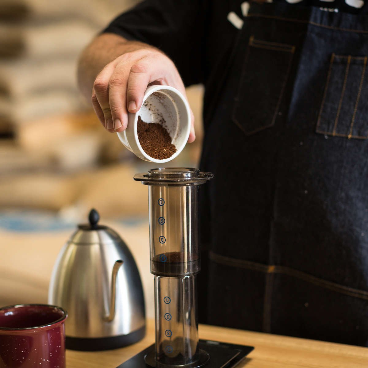 Pouring coffee into Aeropress