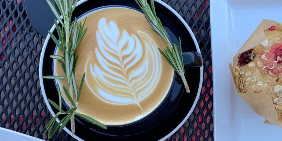 Our Brown Sugar Rosemary Latte with sprigs of Rosemary