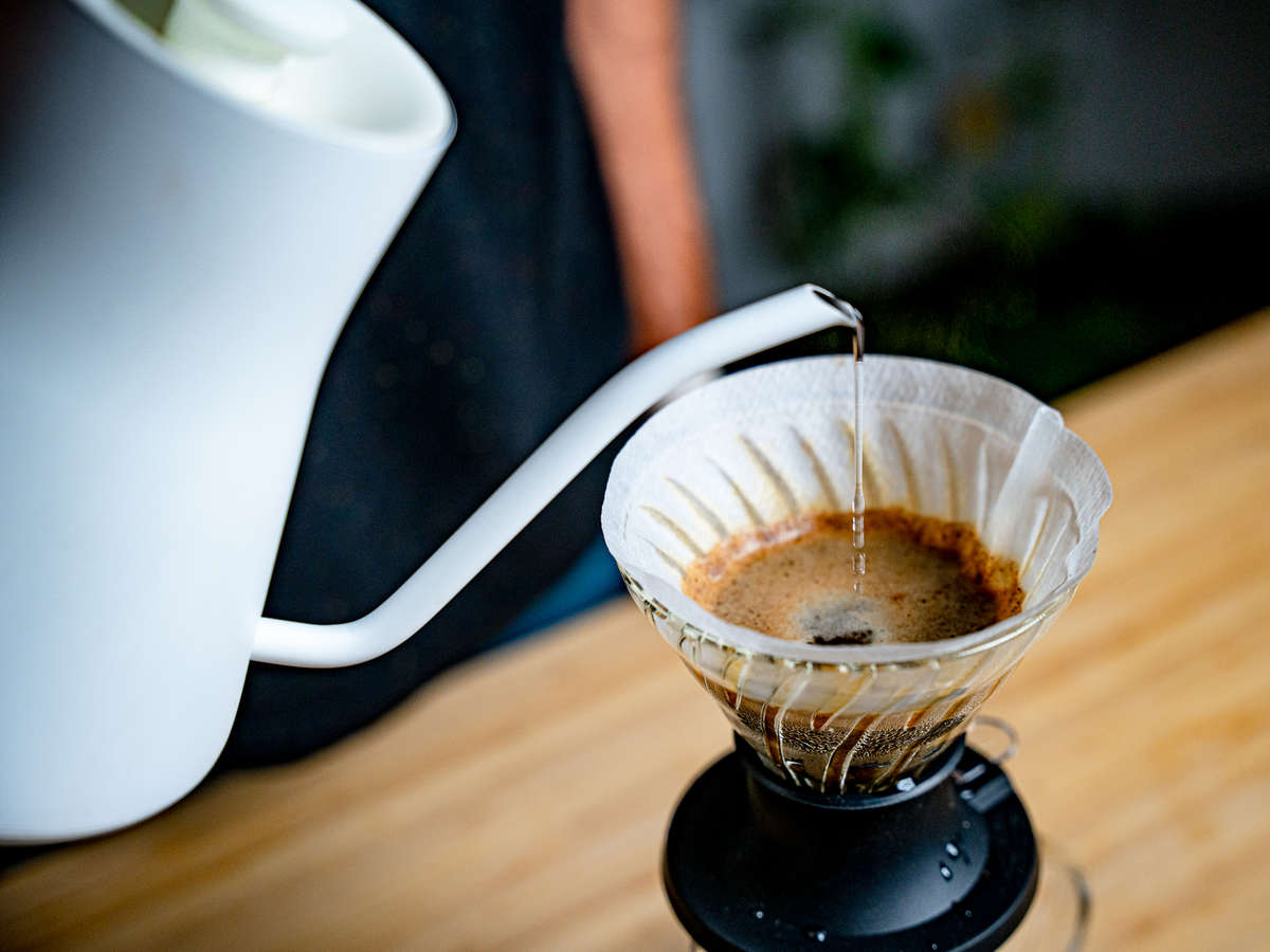 Pouring a Chemex pourover behind the bar