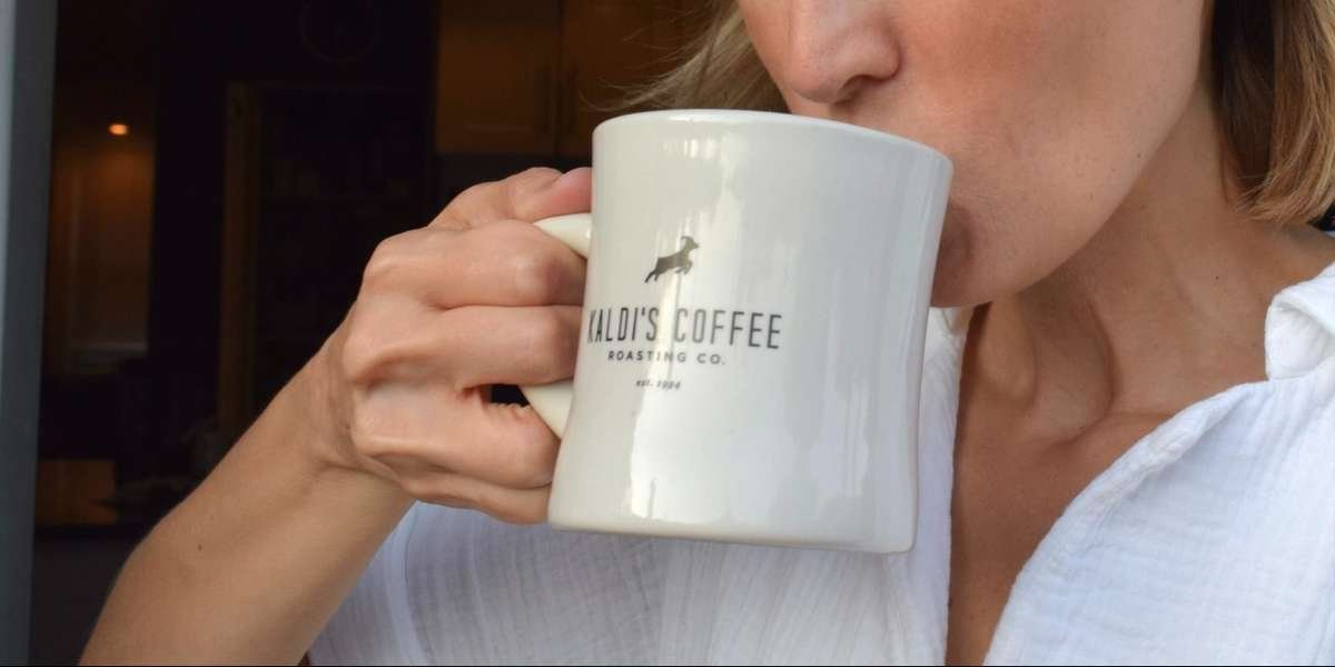Drinking from a Kaldi's Coffee diner mug