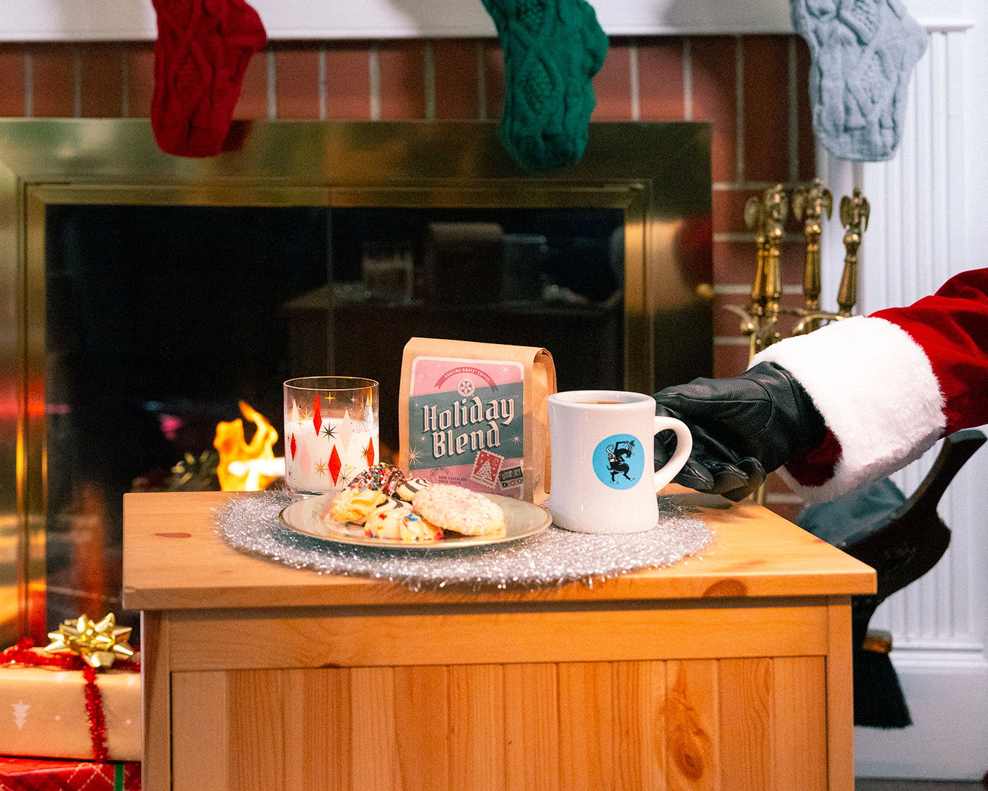 image of santa's hand reaching for dancing goats coffee and mug instead of cookies and milk.