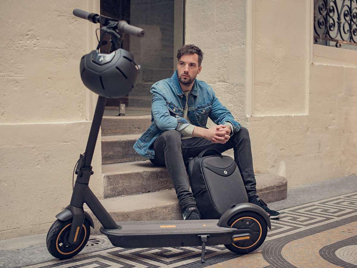 Segway ninebot max electric scooter back pack business man 