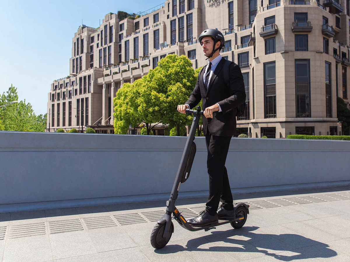 Man in Suit Riding the Segway Ninebot KickScooter