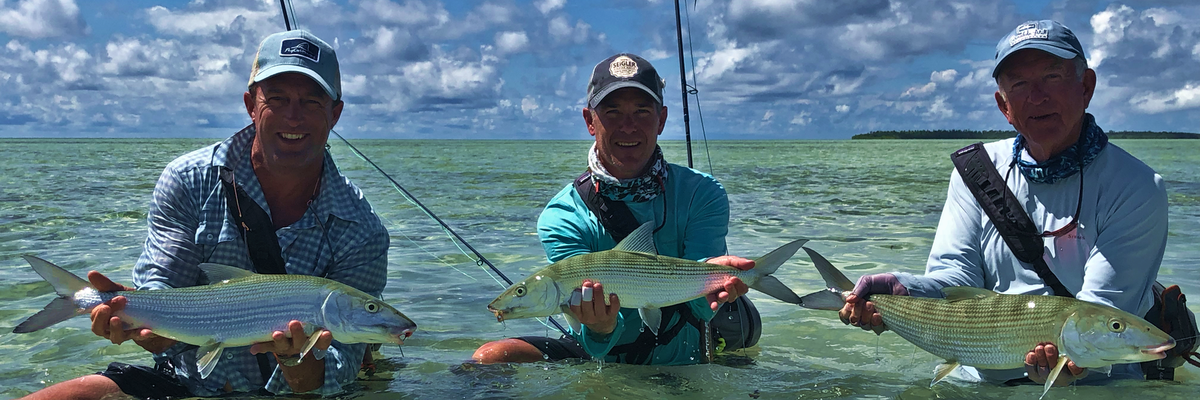Wes Seigler Lake Taylor Bill Taylor all hooked up and holding their proper bonefish for picture. Flats fishing at its best in the seychelles. Bonefishing Triggerfishing flyfishing Wes Seigler Lake Taylor Bill Taylor all hooked up and holding their proper bonefish for picture. Flats fishing at its best in the seychelles. Bonefishing Triggerfishing flyfishing