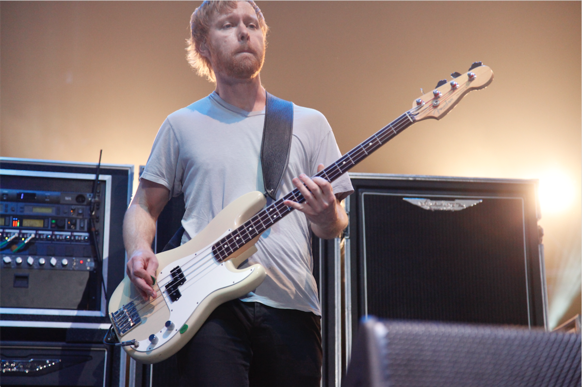 Nate Mendel playing the bass in front of an ashdown rig