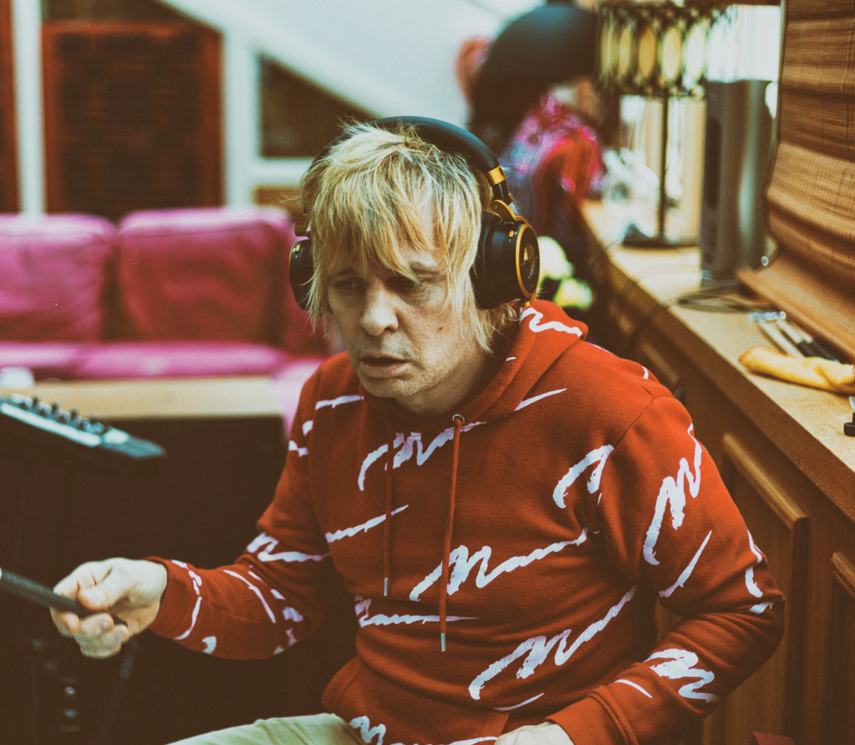 Zak Starkey wearing the Ashdown Meters OV1 b Jamaica soundsystem whilst playing the drums
