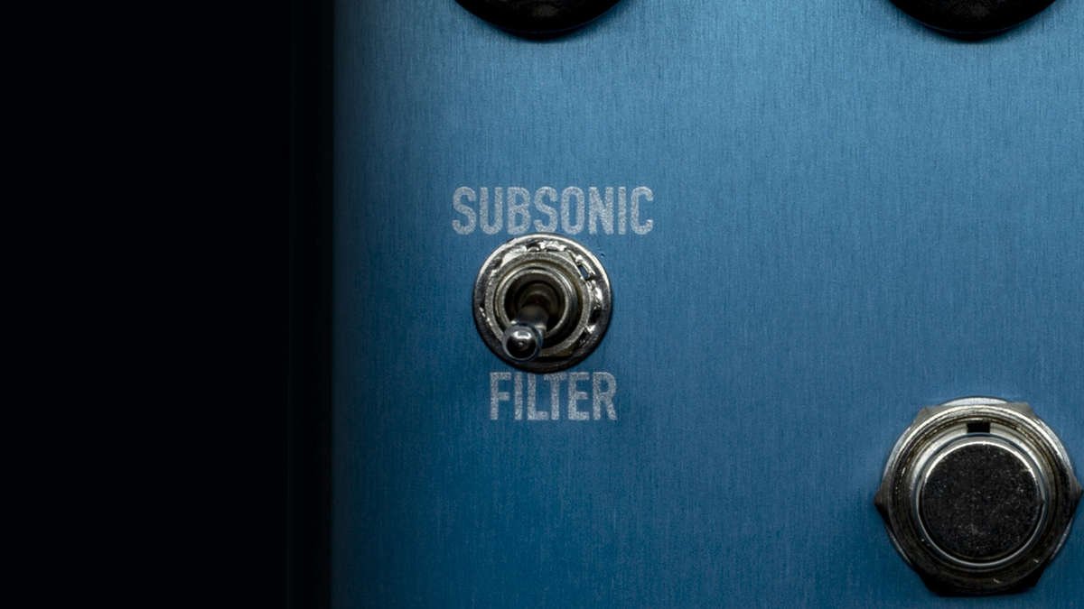 Close up of the subsonic filter switch on the Ashdown Macchiato compressor pedal