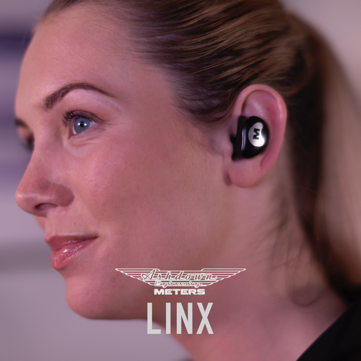 Lady wearing the Ashdown Meters LINX ear buds