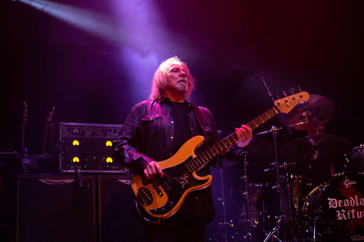 Geezer Butler playing bass on stage with Ashdown Rig