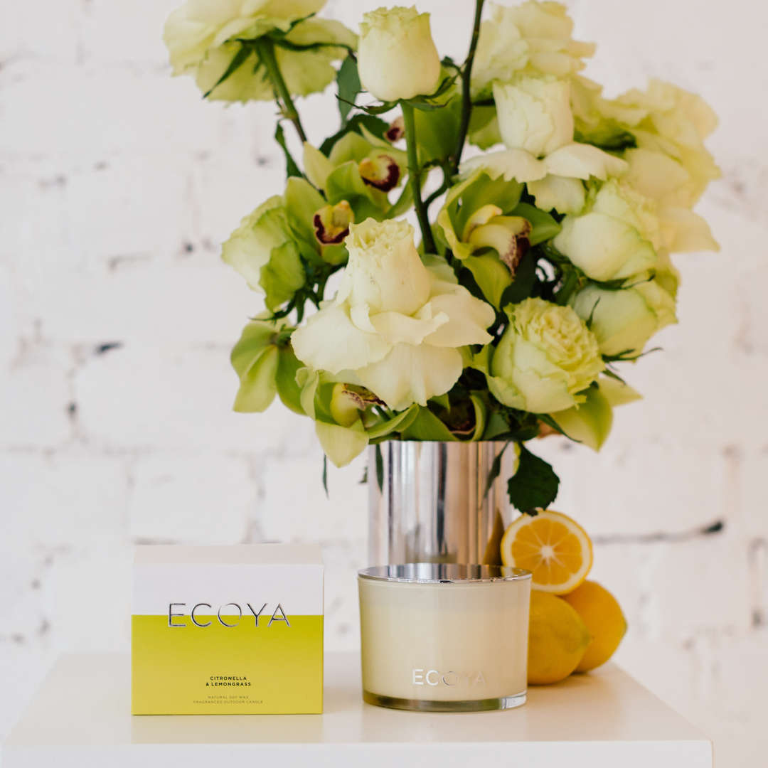 Outdoor candle with flowers and oranges Outdoor candle with flowers and oranges