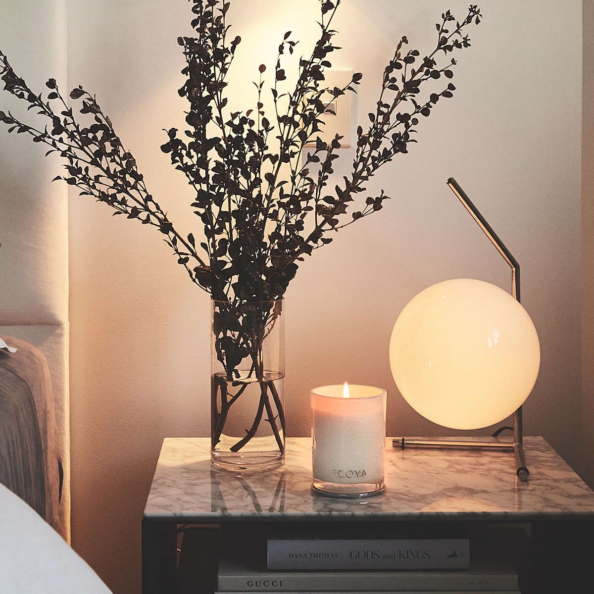 Candle and books with lamp in Anna Southwell's home