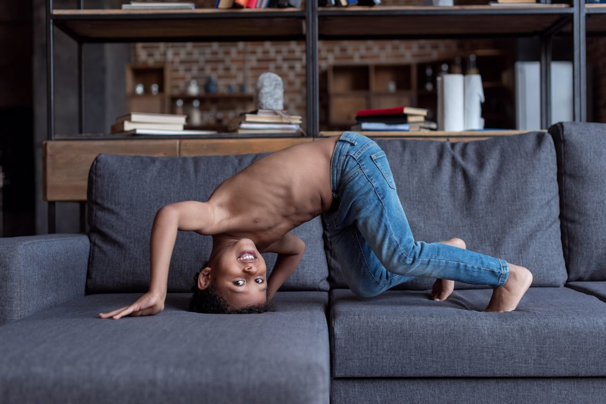 Child doing Somersault on Couch