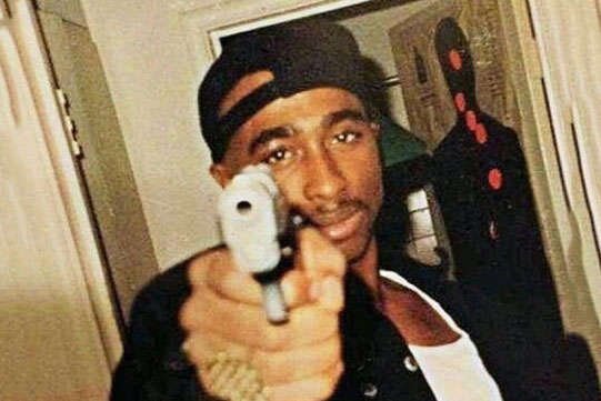 Tupac with a gun