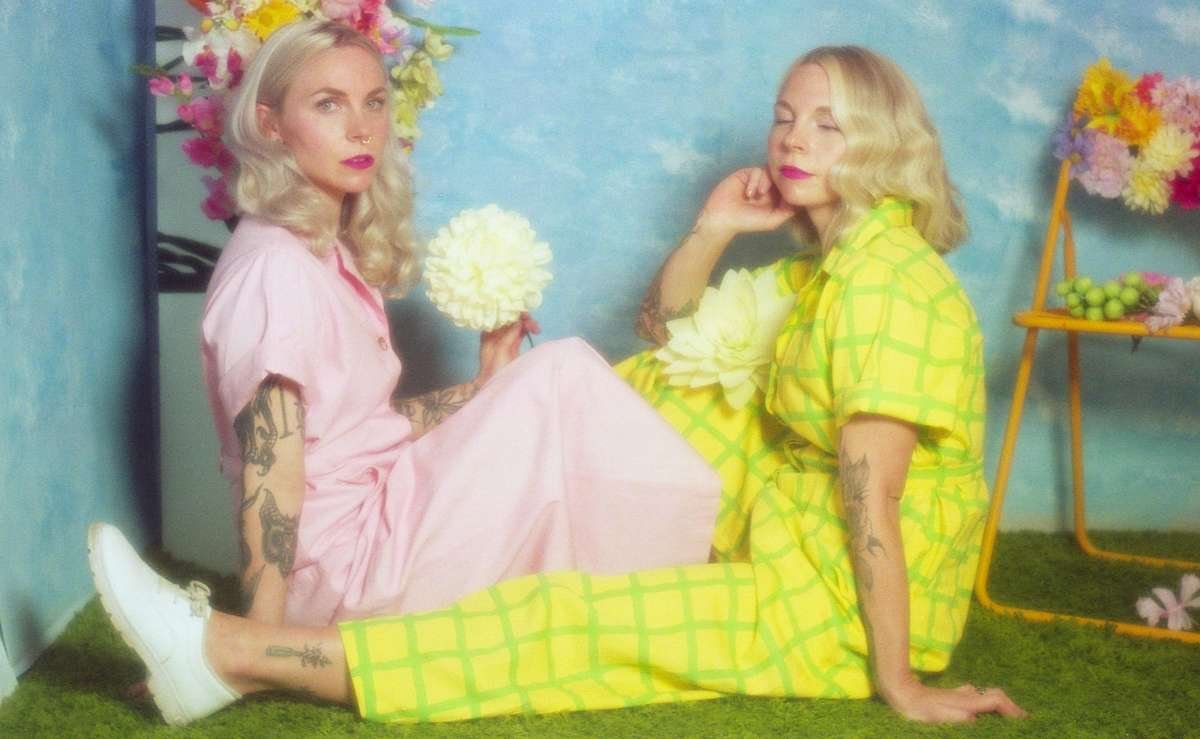 maggie jayne clothing warm weather collection lemon grid block print day suit pink day suit photograph by Heather Rappard of Brumwell twins on an indoor picnic